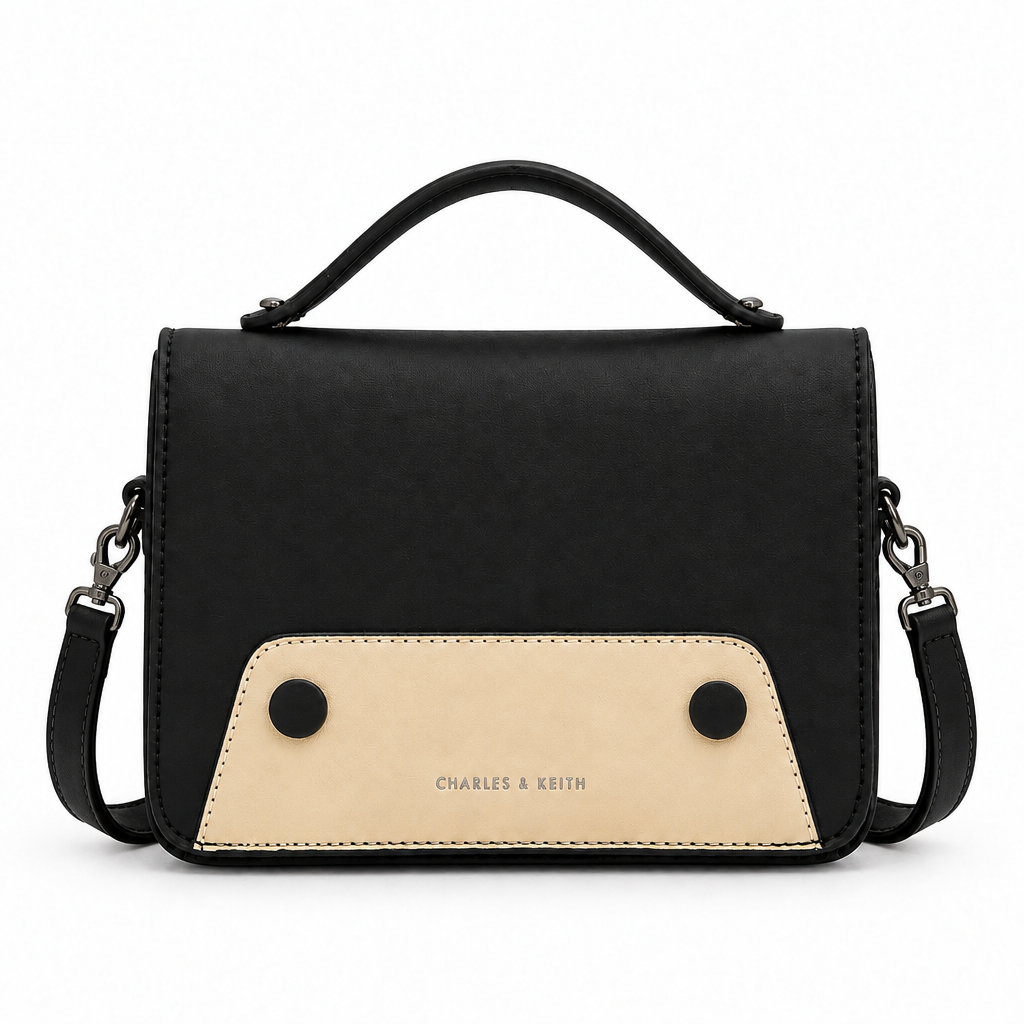 Charles and Keith style flap top handle crossbody bag - black with beige panel, studio view